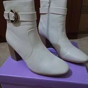Chic White Ankle Boots with Gold Buckle